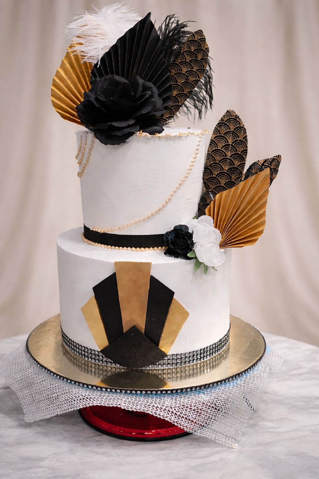 Two-tier art deco cake in black, white and gold